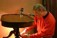 Murray Westbrook, a.k.a. Dr. Woodwell, at work in his antique store